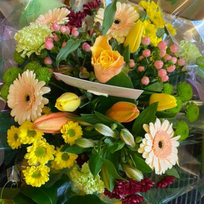 Sunshine Bouquet - A charming bouquet filled with a variety of spring blooms, perfect for bringing a bit of garden beauty indoors.