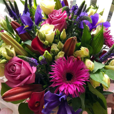 Luxurious Mixed Flower Bouquet - A luxurious bouquet featuring a rich mix of pink, purple, and blue flowers, including roses and lilies. Perfect for special occasions and celebrations.