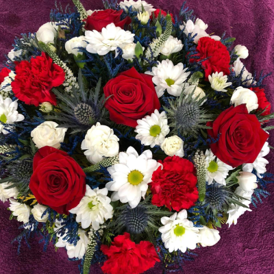 Red, White and Blue Posy - A patriotic red, white, and blue floral arrangement, featuring roses, carnations, and daisies. Suitable for commemorative events.